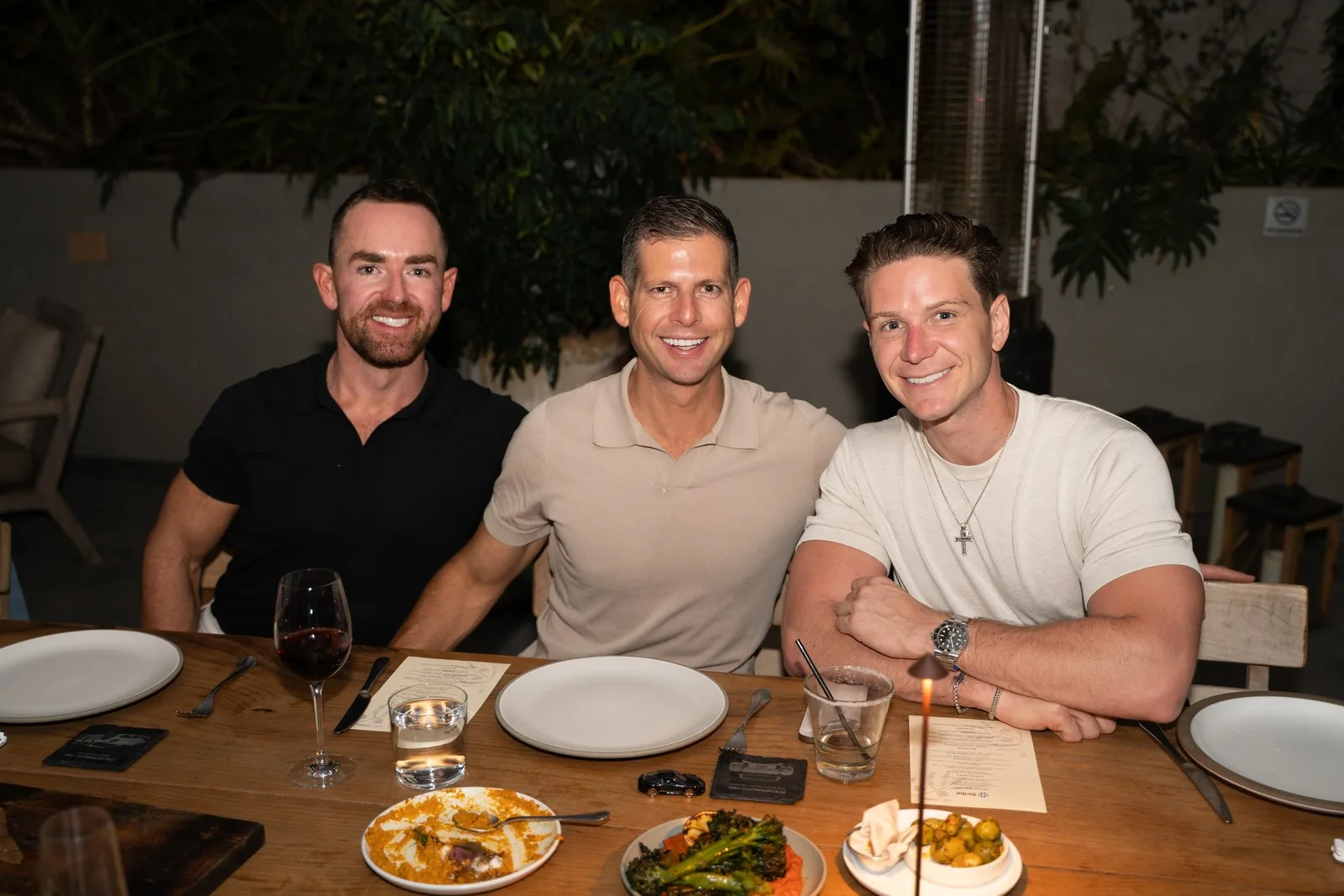 Three IGNITE 2026 participants at dinner in West Hollywood