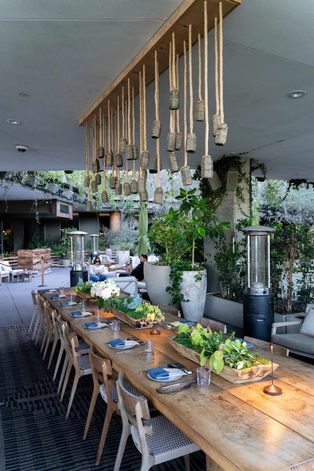 Long dinner table under rope pendant lights at IGNITE 2026