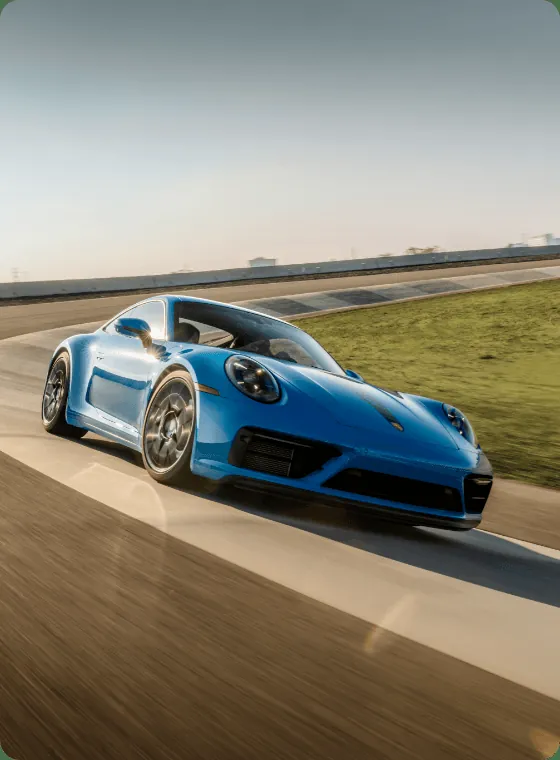 Blue Porsche 911 on the track at Porsche Experience Center