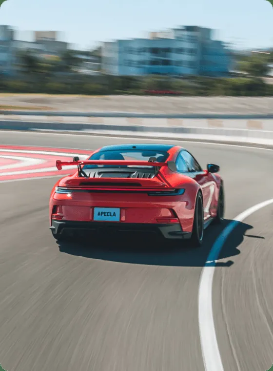Red Porsche 911 GT3 on demo laps at Porsche Experience Center Red Porsche 911 GT3 on demo laps at Porsche Experience Center